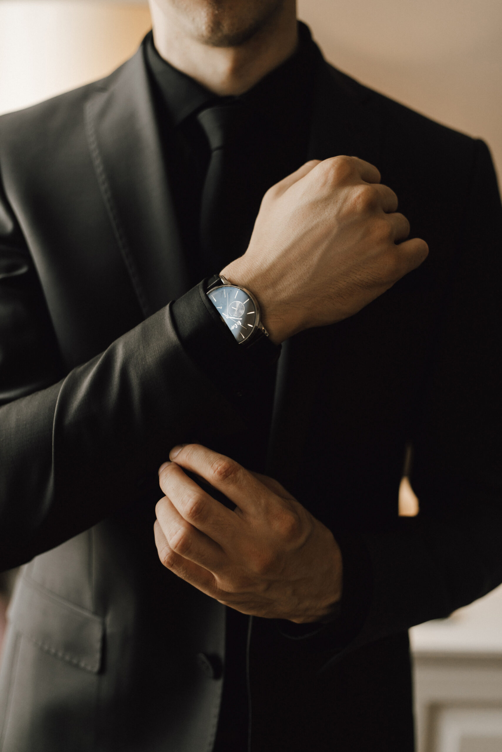 Man fastens a cufflink on his business suit Man fastens a cufflink on his business suit
